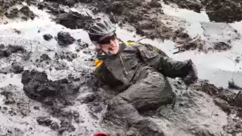 Carl Fogarty gets stuck in mud while mountain biking